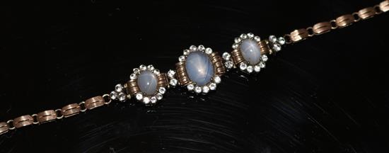 A 19th century gold and silver star sapphire and white sapphire triple cluster bracelet.